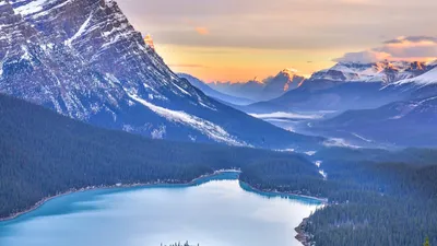 Breathtaking sunrise view of Peyto Lake and the Canadian Rockies in Banff National Park, Alberta.