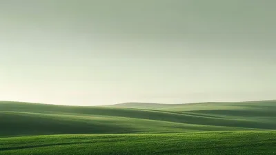 Clear sky after rain over green hills.