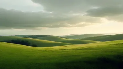 Clear sky after rain over green hills.
