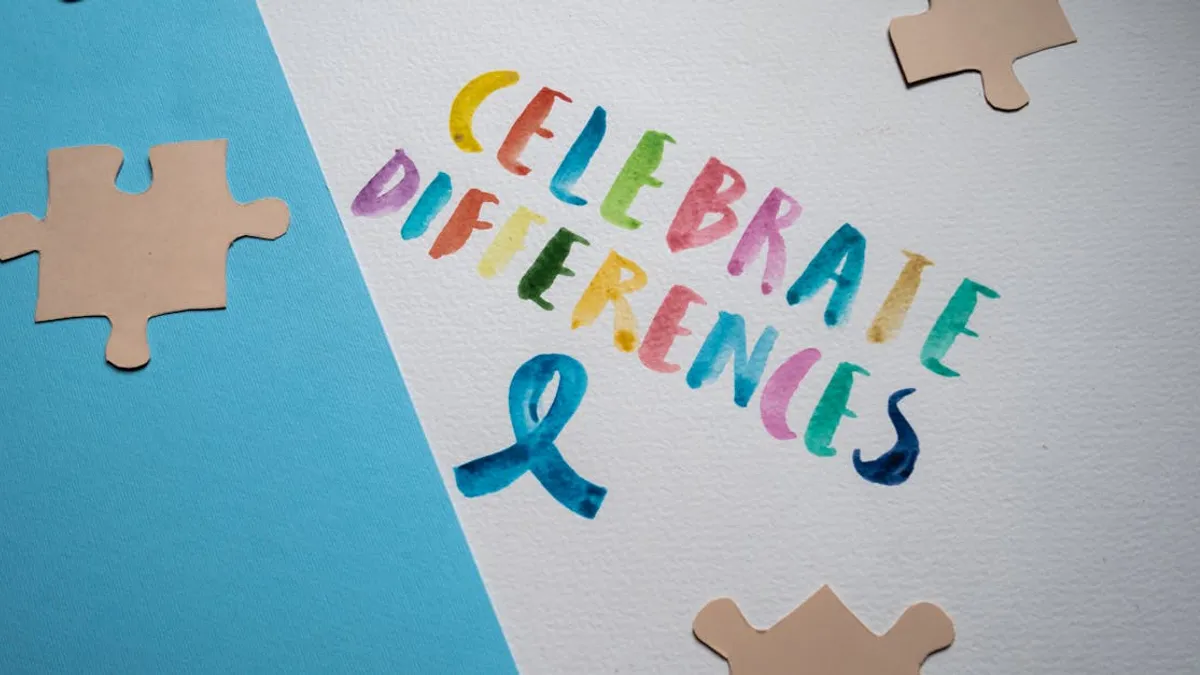 Colorful typography and puzzle pieces celebrate diversity and uniqueness.