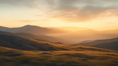 Soft mountain landscape at sunrise.